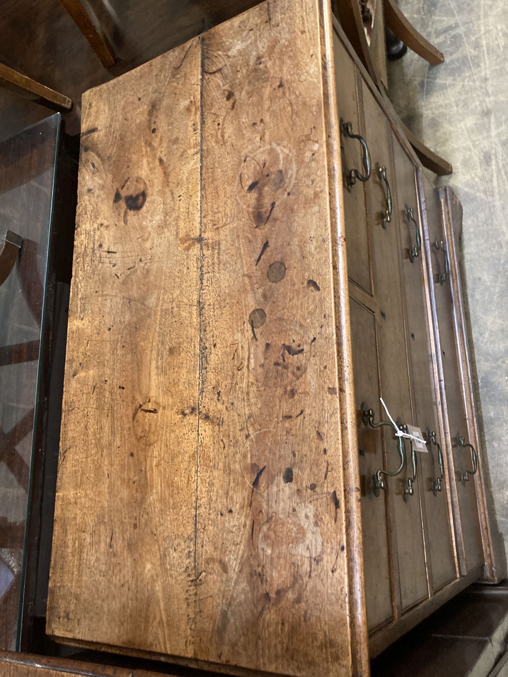 A George II fruitwood chest of two short and three long drawers, with brass drop handles, on bracket feet, width 90cm, depth 47cm, heig